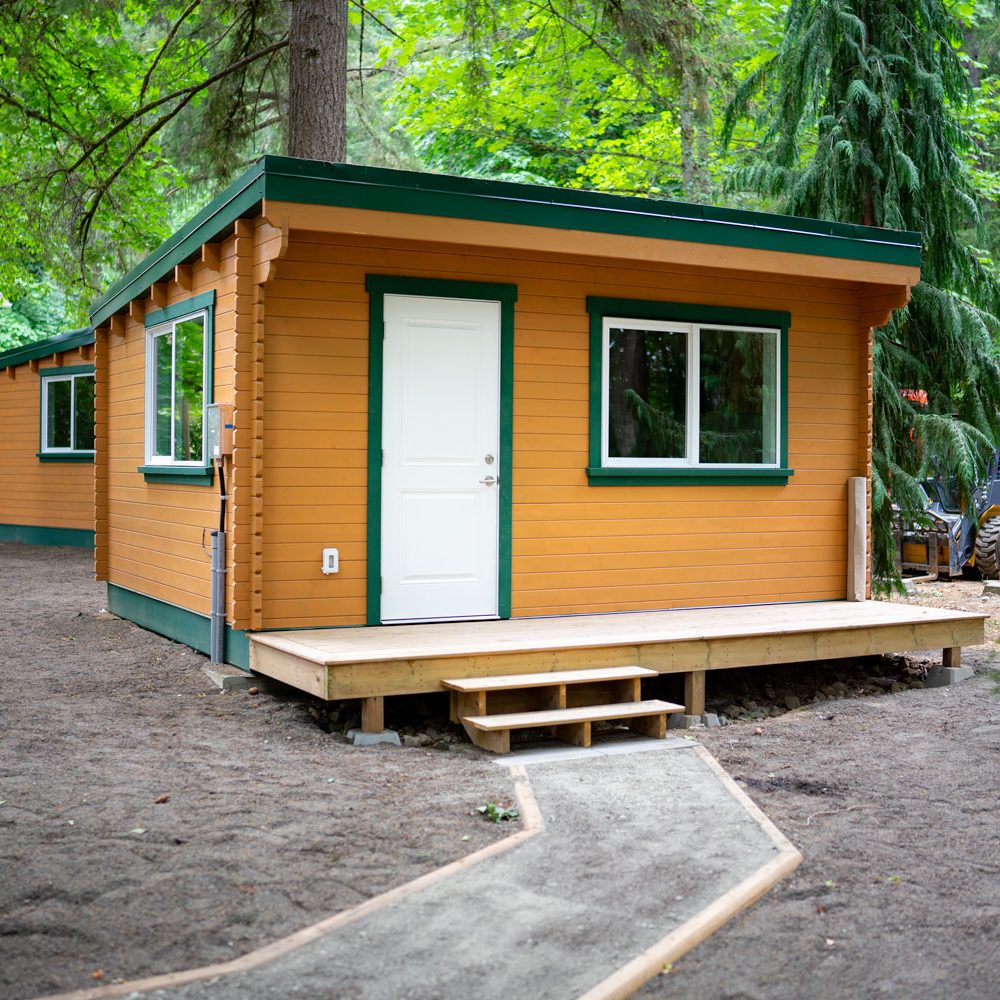 a PacRim Log Structures unit being shown installed on the land of Cowichan Tribes