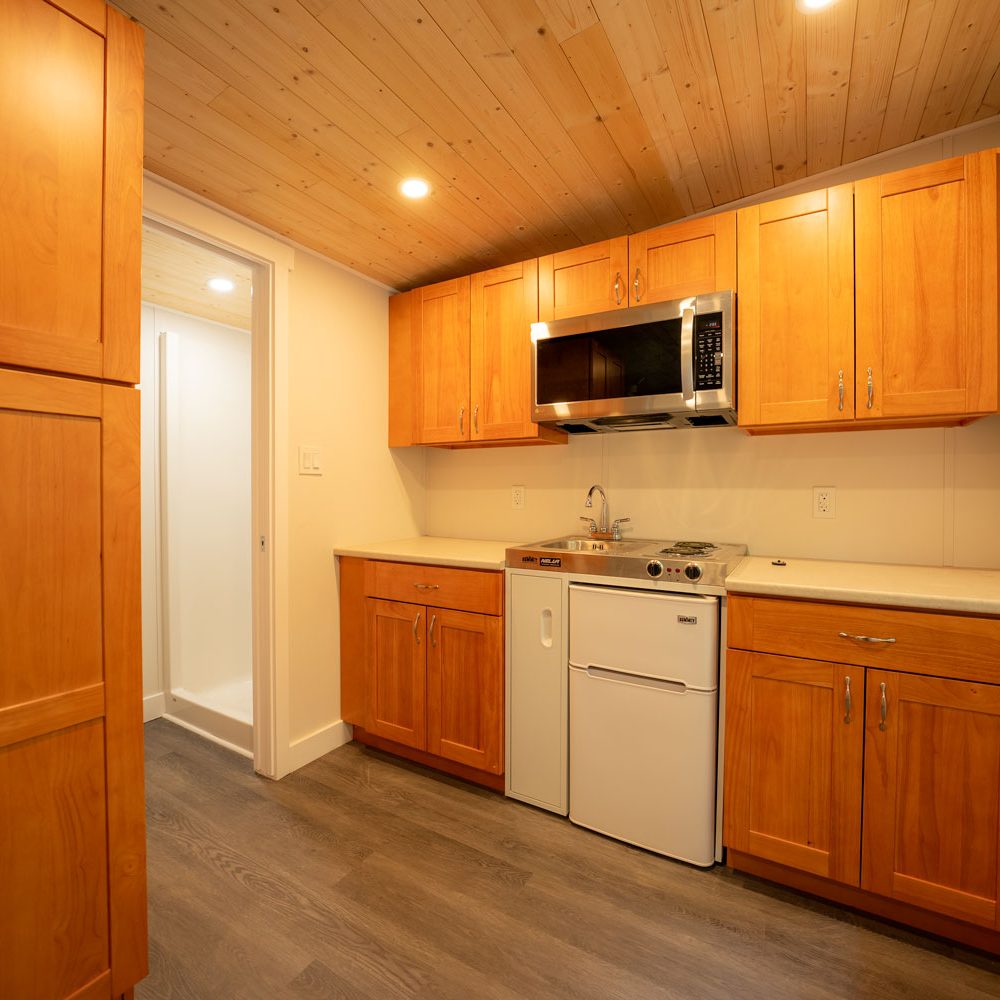 an interior photo showing a kitchen built by PacRim Log Structures and Ecklundson Construction for Cowichan Tribes